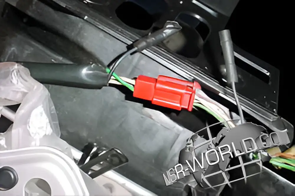 The 1988 NSR250R RC Valve restriction connector is located under the passenger seat by the tail lights.